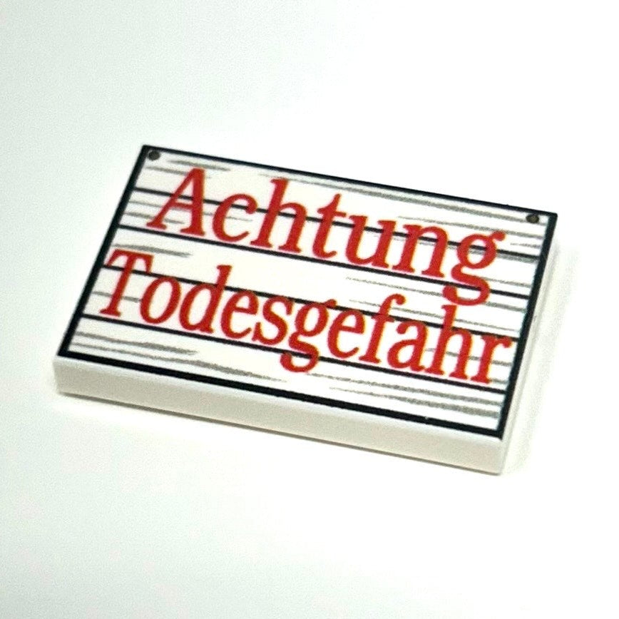Rectangular sign with 'Achtung Todesgefahr' text on a white background