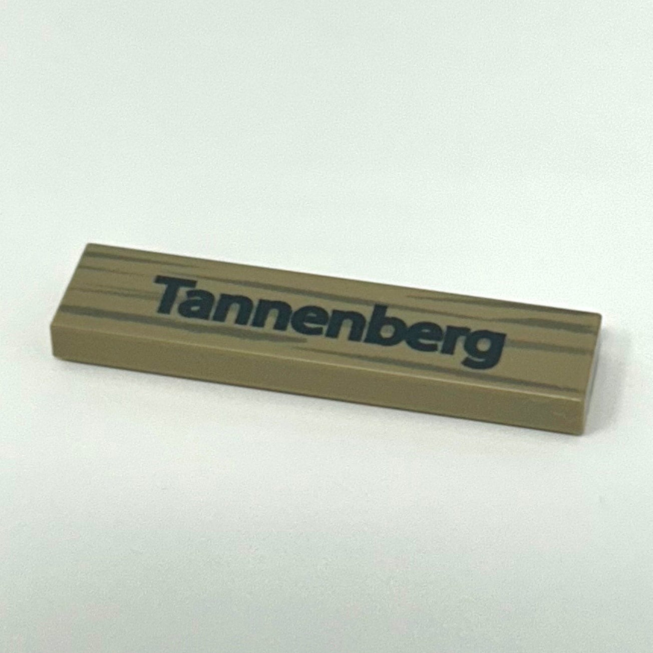 Rectangular wooden block with 'Tannenberg' branding on a white background