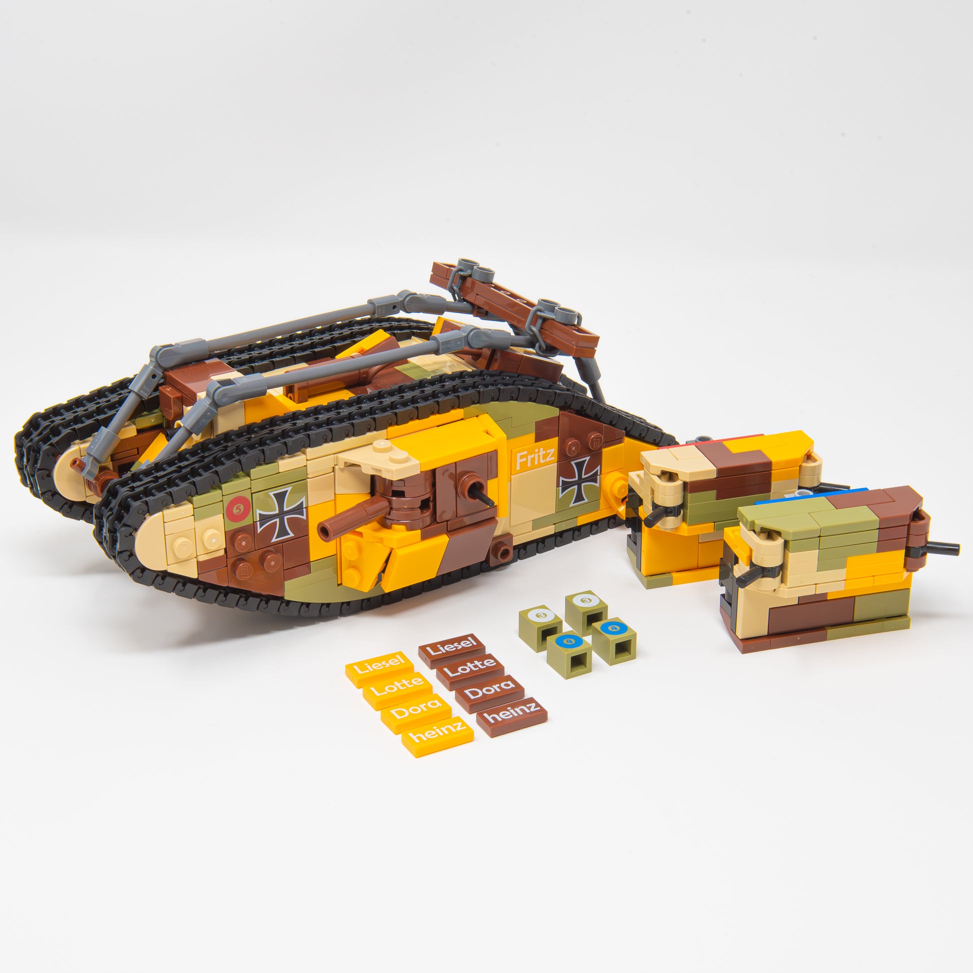 Toy tank model with additional pieces on a white background